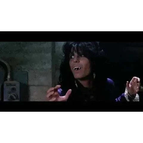 Vinegar Syndrome Blood Tracks Blu-Ray cover featuring vampiric character in horror scene.