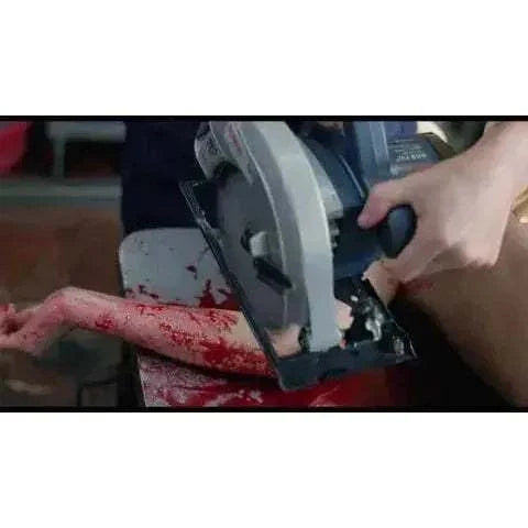 Vinegar Syndrome - Ebola Syndrome 4K UHD + Blu-Ray movie scene with circular saw.