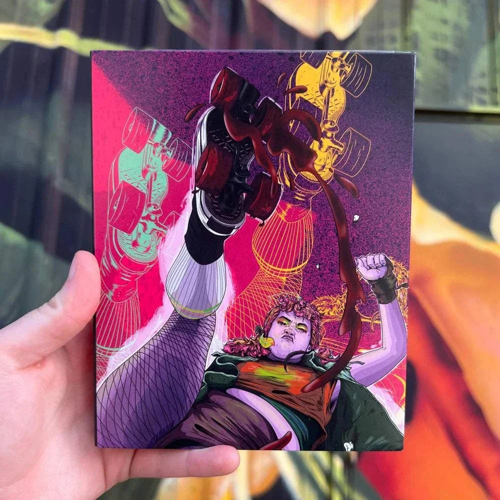 Hand holding Thrust! (The Punk Cut!) Blu-ray with vibrant illustrated cover featuring punk characters and bold text "Thrust! The End of Men!"