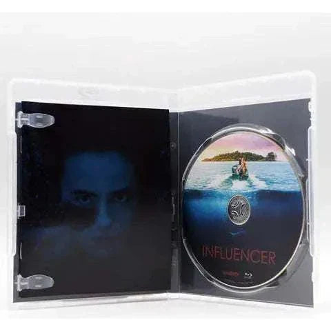 Open Shudder Influencer Blu-Ray case showing disc with island and water design and dark-themed interior artwork with face image