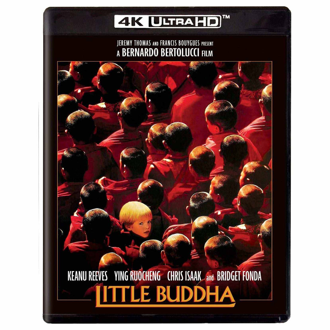 Little Buddha 4K UHD Blu-Ray cover featuring monks in red robes and a young boy, starring Keanu Reeves and Bridget Fonda.