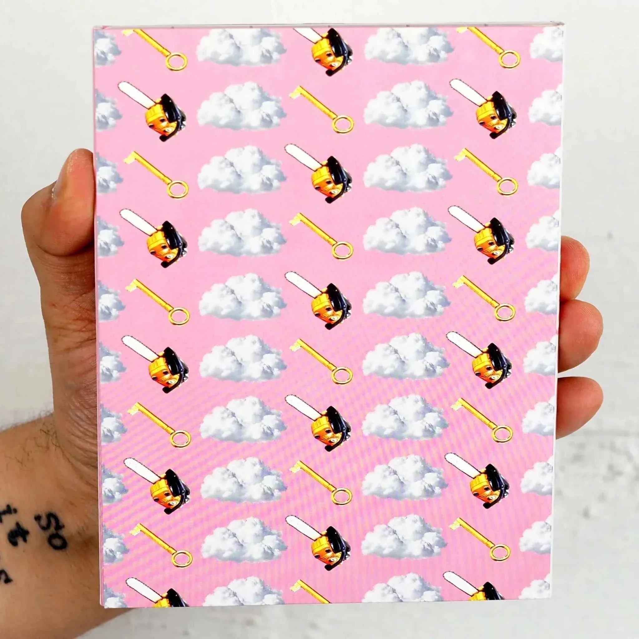 Mother, Couch Blu-Ray with slipcover featuring eye-catching pink design with ice cream and cloud pattern held in hand.