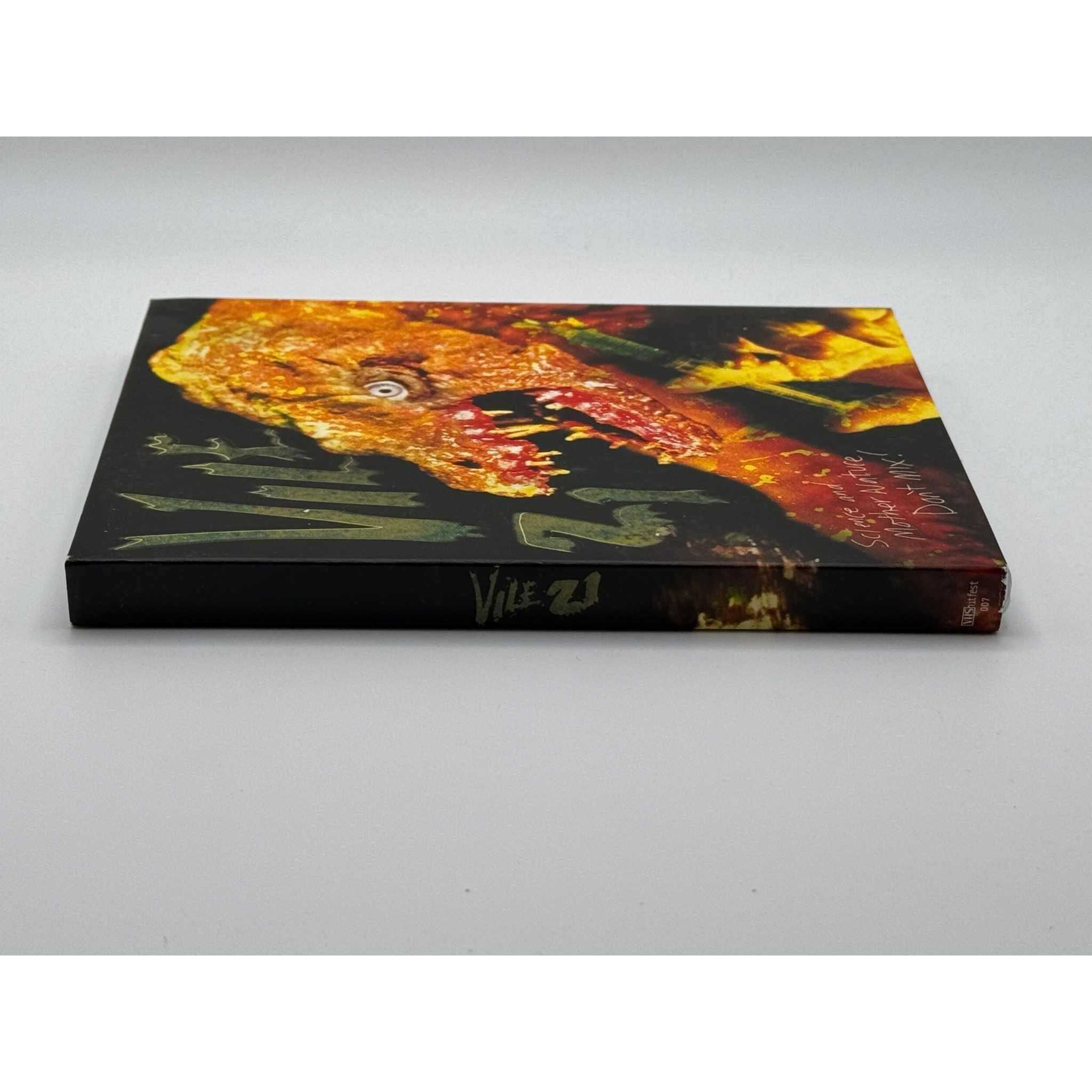 Vile 21 Blu-Ray used with slipcover, featuring minor wear, horror satire.