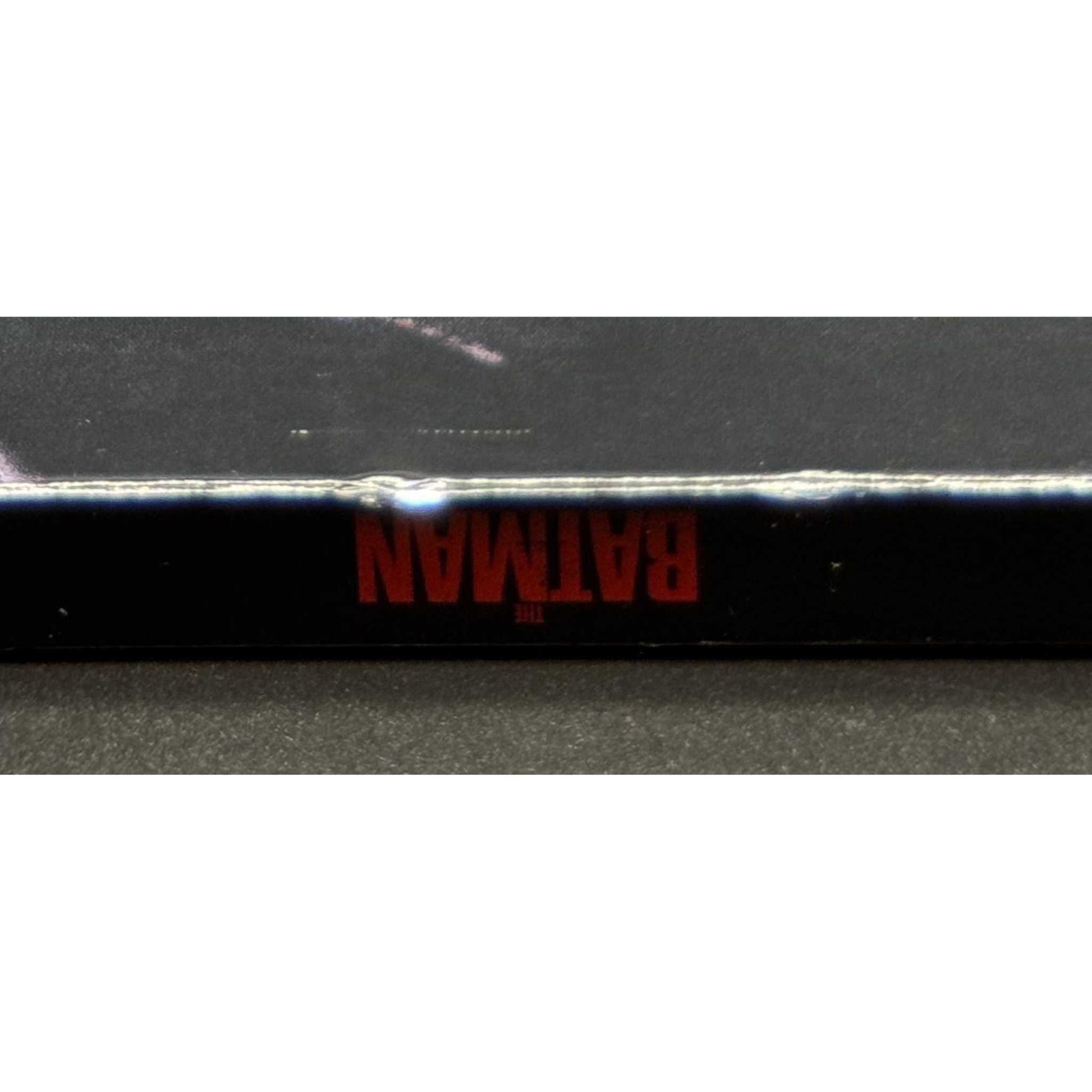 The Batman 4K UHD Blu-Ray used with slipcover showing wear and marks.