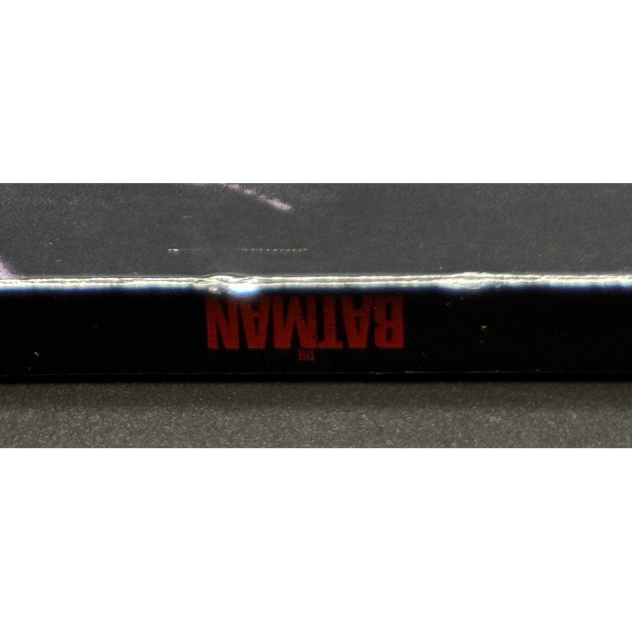 The Batman 4K UHD Blu-Ray used with slipcover showing wear and marks.