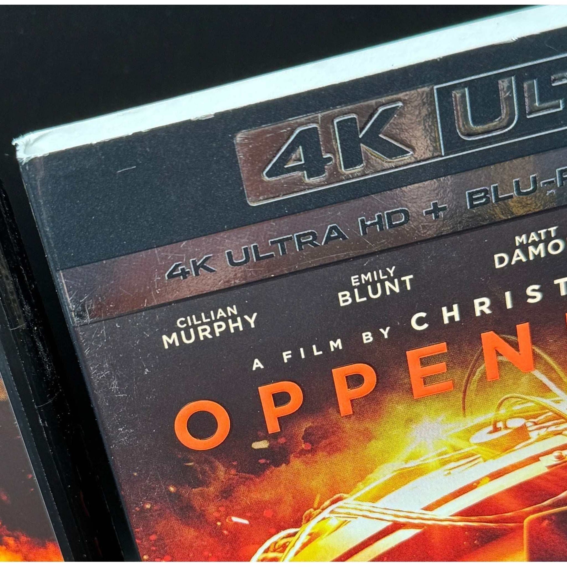 Oppenheimer 4K UHD + Blu-Ray used with slipcover showing some wear.