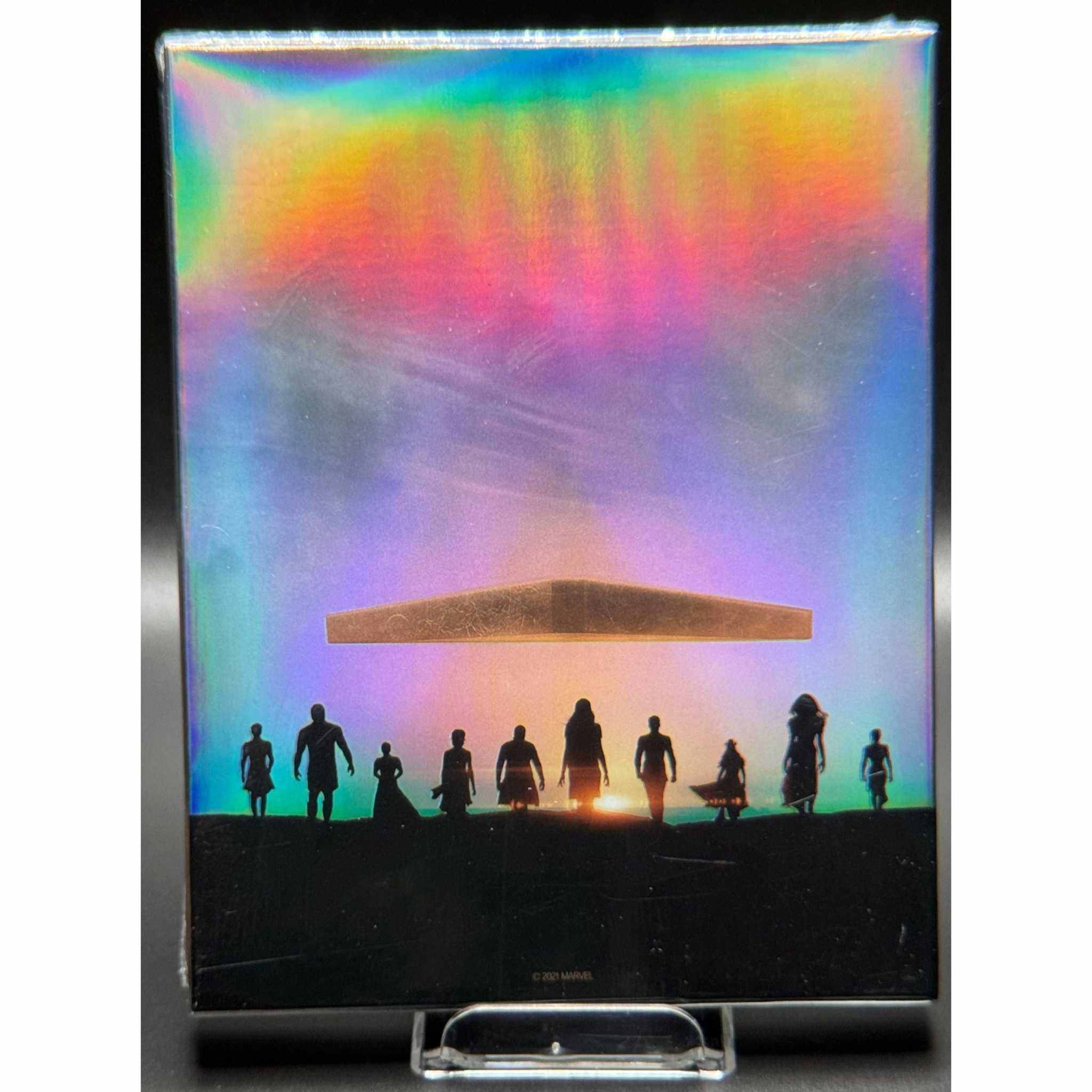 Eternals Blu-Ray Steelbook with Limited Edition Full Slip featuring rainbow holographic design and silhouettes of characters.