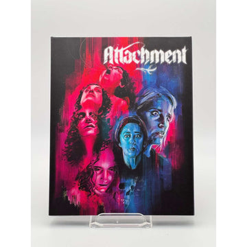 Shudder: Attachment Blu-Ray with slipcover featuring vibrant horror romance artwork of multiple female faces in red and blue tones.