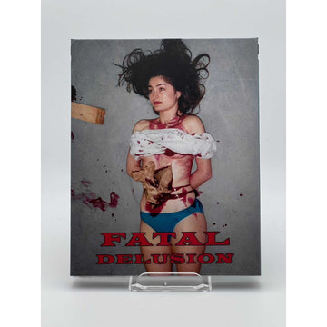 Saturn's Core Fatal Delusion Blu-Ray cover featuring a bloodied woman in blue underwear and a torn white shirt against a gray background