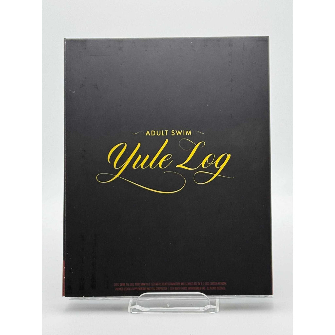 Dekanalog Adult Swim Yule Log Blu-Ray with lenticular slipcover featuring a cozy crackling fire design