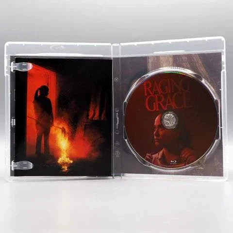 Raging Grace Blu-Ray open case showing disc with woman's face and red title, and inside cover with shadowed figure near fire.