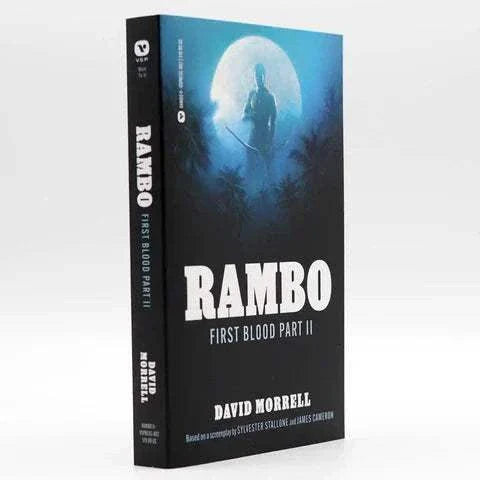 Paperback book cover of "Rambo: First Blood Part II Novelization" by David Morrell with a silhouette of Rambo against a full moon background.
