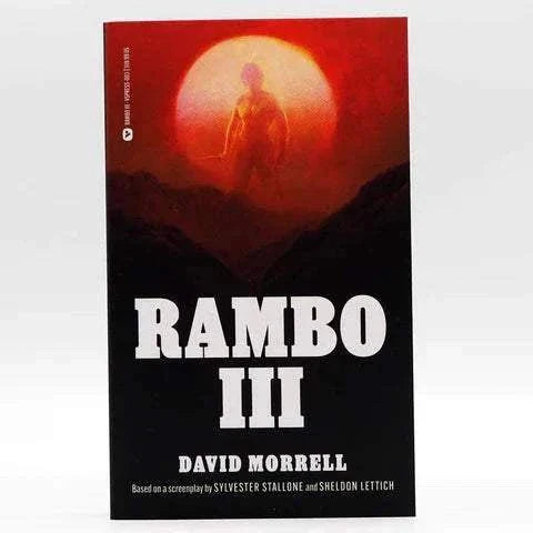 Rambo III novelization paperback book by David Morrell with red and black cover featuring a silhouette against a large red sun.