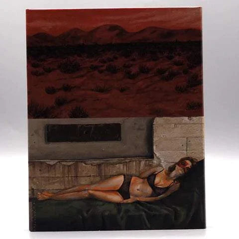 Dekanalog Redlands Blu-Ray slipcover featuring neo-noir artwork of a woman reclining in a dark desert setting