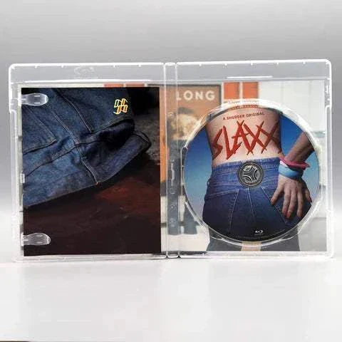Open Shudder - Slaxx Blu-ray case showing disc with jeans-themed horror movie cover and interior artwork featuring a close-up of denim jeans.