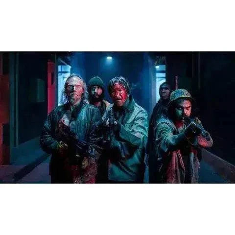 Vinegar Syndrome Pictures Street Trash 2024 Blu-ray featuring a group of bloodied characters holding weapons in a dark urban setting