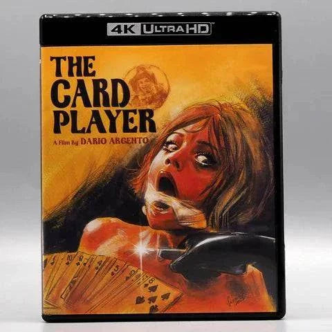 Vinegar Syndrome The Card Player 4K UHD cover featuring a distressed woman with taped mouth and a gun pointed at her face with playing cards in foreground