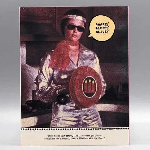 The Scare Film Archives Volume 2 Blu-Ray cover featuring a person in a silver suit with a red shield, text bubble stating "Aware! Alert! Alive!"