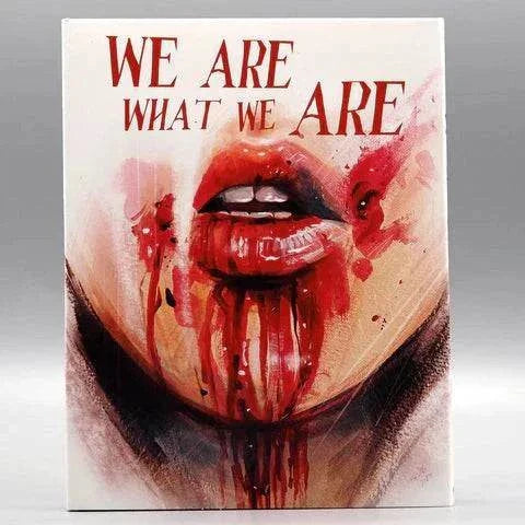 We Are What We Are Blu-Ray slipcover featuring close-up illustration of a mouth with blood dripping from lips and tongue.