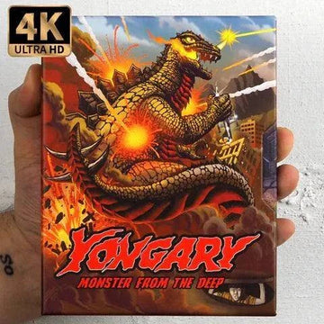 Hand holding 4K UHD Blu-ray slipcase of Yongary, Monster from the Deep featuring fiery monster artwork and bold red title text.