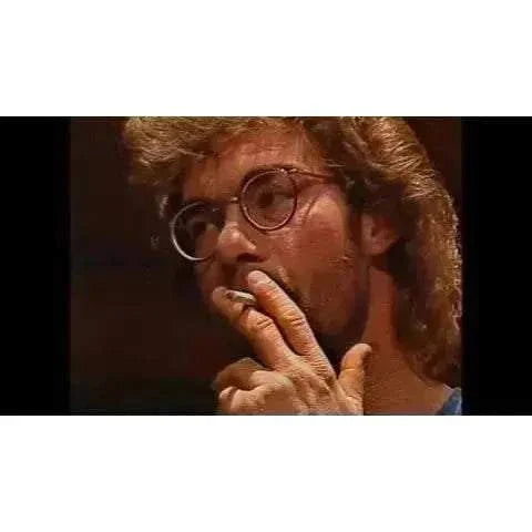 VHSHitfest - Blind Faith movie scene featuring a character smoking with glasses.