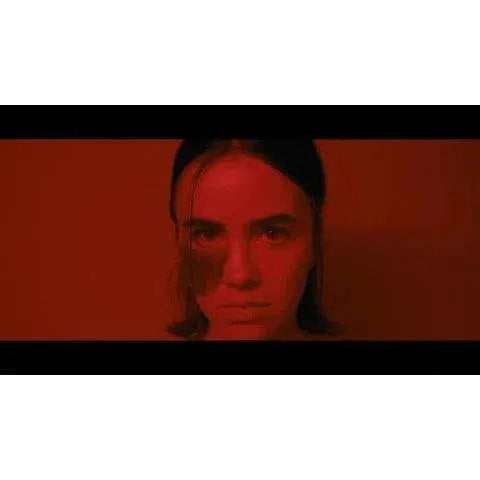 Shudder Influencer Blu-Ray cover featuring intense close-up of a woman's face in red lighting with slipcover packaging.