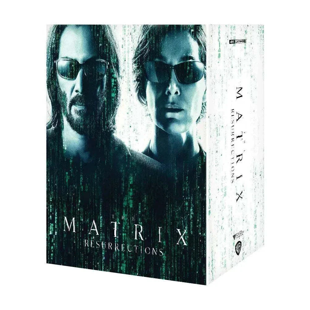 The Matrix Resurrections 4K UHD and Blu-Ray steelbook box set with Keanu Reeves and Carrie-Anne Moss cover featuring glow in the dark Dejavu Cat figure and exclusive collectibles.