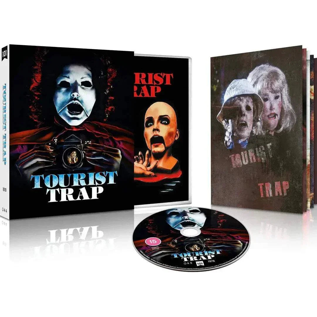 Tourist Trap Limited Edition Blu-Ray with slipcover and booklet featuring horror movie cover art of a mannequin holding a camera with a frightened woman reflected in the lens